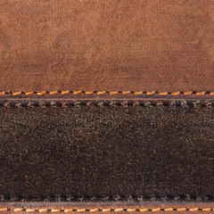 Seamless 4k photo texture photo of brown colored suede and leather material with red stitching.
