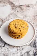 Pile of chocolate chip cookies on a dish