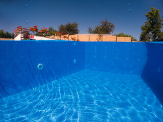 crystal clear blue water in swimming pool