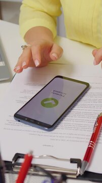 Vertical Screen: Close-up woman hand use cashless wifi app to buy online. Order and payment online contactless.