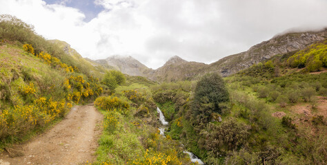 Natural landscape with waterfall and mountains in the Somiedo Natural Park, Spain
