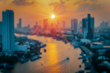 Fototapeta premium A multi-story building silhouetted against a stunning sunset, with warm orange and pink hues lighting up the sky. The scene captures the calm beauty of the evening.