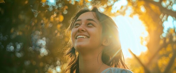 Fototapeta premium A beautiful girl, her face radiating happiness
