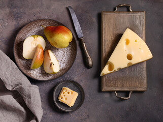 cheese on a board and fresh fruit for a snack