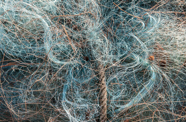 Fishermen's fishing nets are piled up.