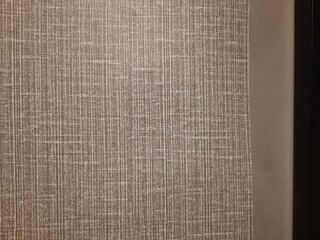Fabric texture in wallpaper of bedroom