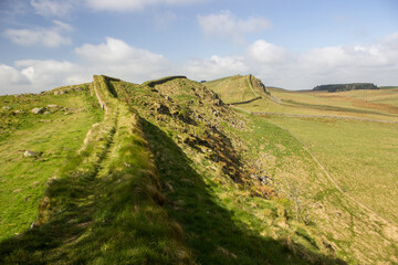 The Impressive Roman Ruins of Hadrian’s Wall, snaking through the English countryside along the Winshields cliffs