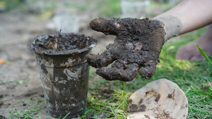 dirty hands and plastic cups