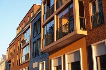 Close up of new modern building brick facade with brown blocks and balconies in Noblessner...