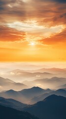 Fototapeta premium Mesmerizing mountain landscape with a stunning sunrise, layers of mist, and vibrant colors painting the sky, creating a serene atmosphere.