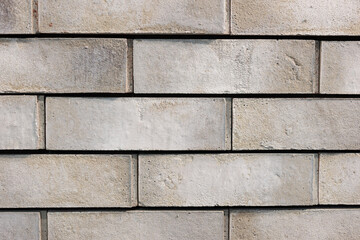 Background with a wide texture of decorative gray brick wall. Background for home or office design.