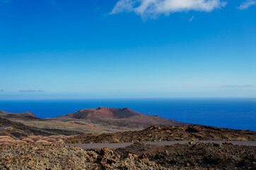 Above the La Orchilla lighthouse (Island of El Hierro, Canary Islands), is the volcano of the same name, which like an ancient guardian takes care of its lighthouse.