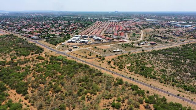 aerial view, Gaborone suburbia Phakalane, residential and industrial, Botswana highway interstate, traffic, bush wilderness