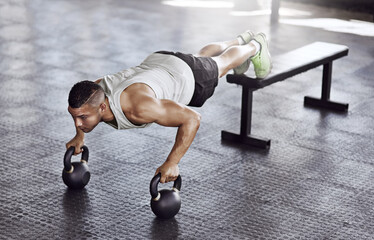 Fitness, push ups and man in gym with kettlebell for strength training, endurance challenge or muscle growth. Power, wellness and athlete for bodybuilding, performance workout or chest exercise
