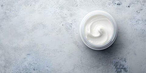 Top view of waterless cream jar with organic sustainable chemicalfree skincare. Concept Sustainable Skincare, Chemical-Free Products, Top View Photography, Cosmetic Packaging, Organic Ingredients