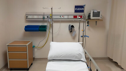 Clean and Organized Emergency Room with Medical Equipment and Bed in a Hospital