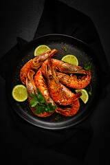Langoustines, Australian, freshly frozen on ice, top view, lime and greens,