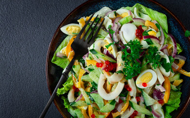 salad with squid, fresh cucumber, eggs, sweet pepper, red onion, with dressing, homemade, no people,
