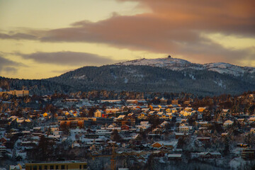 The scenery shows a snowy landscape with a mountain towering in the background