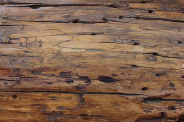 Fototapeta premium Wooden background. Aged brown wood raw natural abstract texture backdrop with cracks. Design element. Copy space