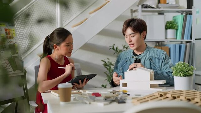Meeting in a modern architectural office asian architect and interior designer working creative space planing design discuss brainstorm ideas sharing together Architect Team working best solution