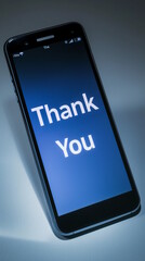 Smartphone screen displaying "Thank You" message in dark setting, symbolizing gratitude and appreciation. The modern and simple design emphasizes the importance of expressing thanks in the digital age