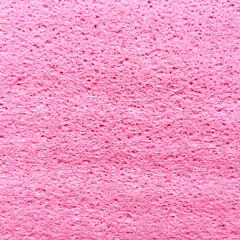 Texture of a synthetic pink kitchen rag close up