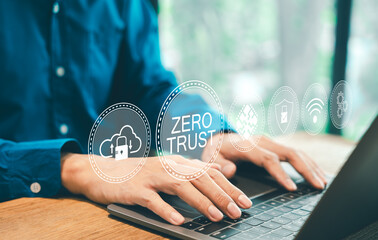 Zero Trust Security Concept. A person types on a laptop with virtual icons zero trust security, cloud protection, business information network security, shields, connectivity, cybersecurity measures,