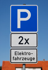 Parking sign for two electric vehicles