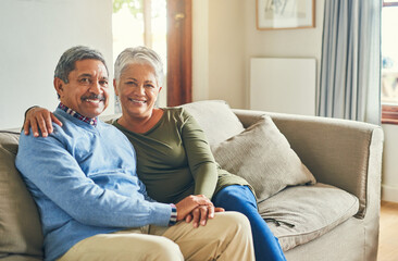 Smile, portrait or senior couple on couch for hug, wellness or proud for financial stability. Senior woman, happy man and love in living room for commitment, comfort and milestone in marriage at home