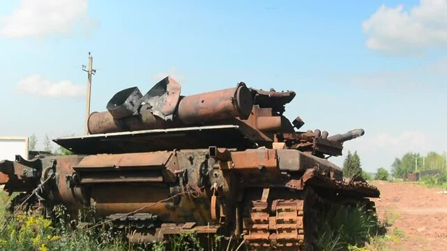 An old broken Soviet tank covered with rust.