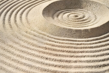 Naklejka premium A circle in the sand. Zen Japanese garden. Background.