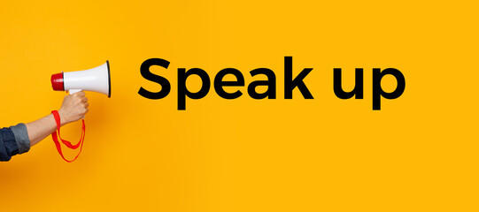 Person with a megaphone and a text saying speak up