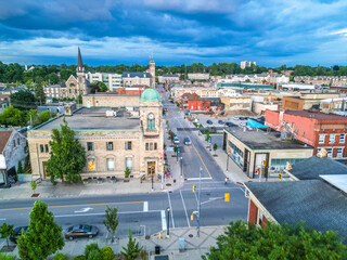 Aerial Birds Eye view of Cambridge Waterloo region Ontario Toronto Canada architecture European style building road street with cars and clouds in the sky