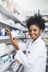 Pharmacist, portrait and black woman with product in clinic for medicine stock, reading and check...