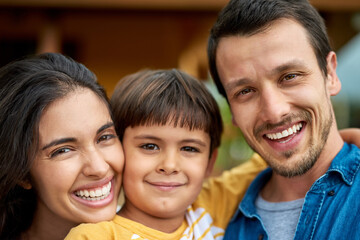 Family, portrait and outside home with mother, parents and son together. Love, smile and father relax with mama and happy child in house garden with support and care in backyard for childhood