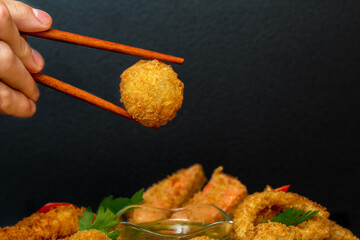 hand holding a bowl of rice