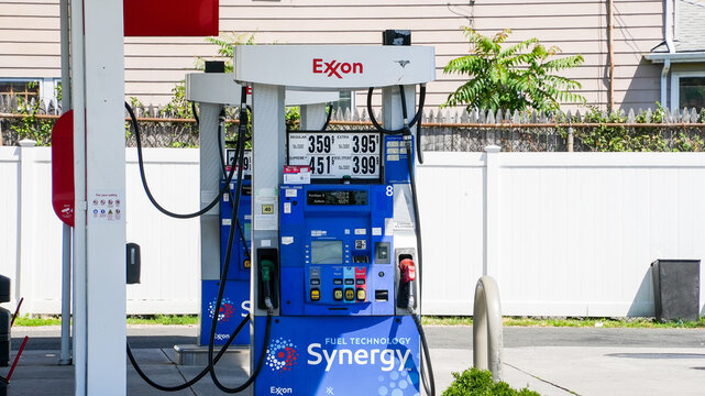 NORWALK, CT, USa - JULY 3, 2024: Exxon gas station pump with price display and Synergy logo on a sunny day