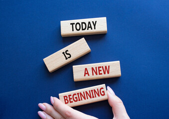 Today is a new beginning symbol. Wooden blocks with words Today is a new beginning. Beautiful deep...