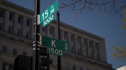 K street nw and 15th street nw street signs in downtown Washington DC symbolizing lobbying and corruption in nations capital