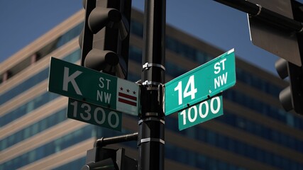 K street nw and 14th street nw street signs in downtown Washington DC symbolizing lobbying and corruption in nations capital