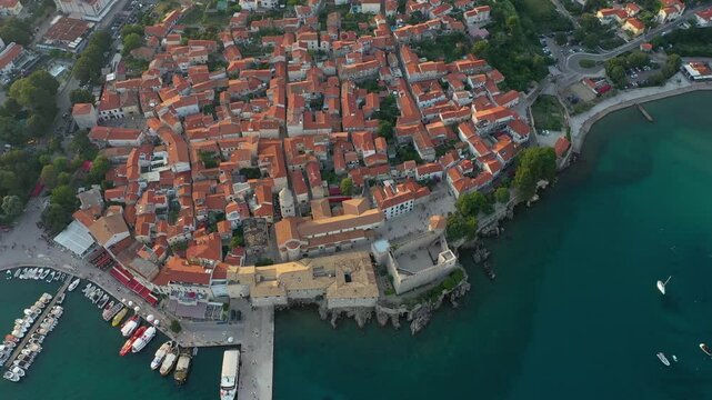Panoramic view of the old town of Krk in Croatia, cathedral tower and seascape in background