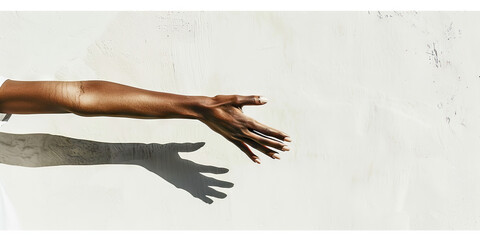 Artful Arrangement: A graceful woman's arms and hands form a striking composition against a blank, white wall.