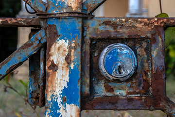 Detail of a lock on an old iron gate at the entrance of a house in Brazil