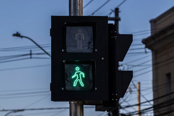 Green go traffic light, for pedestrians on the street in downtown of the city in Brazil
