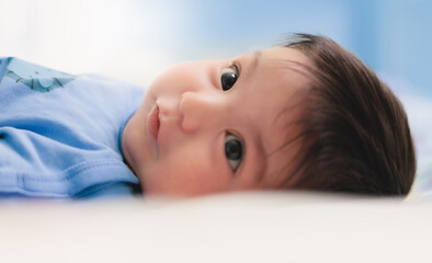 cute baby on a white sheet