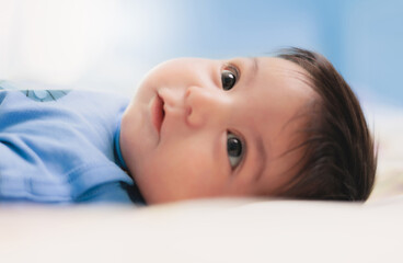 cute baby on a white sheet