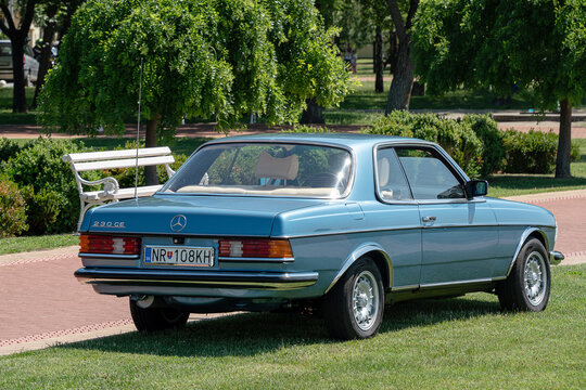 Back-side view of Mercedes-Benz C123 (w123 coupe) 230CE (benzin (petrol), injector 2.3l 1980-1985) in blue color. Palic, Serbia, 08.06.2024