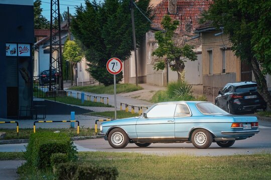 Mercedes-Benz C123 (w123 coupe) 230CE (benzin (petrol), injector 2.3l 1980-1985) in blue color is driving in Subotica, Serbia, 08.06.2024
