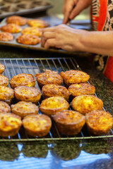 trays with muffins fresh taken out of the oven on the kitchen countertop
